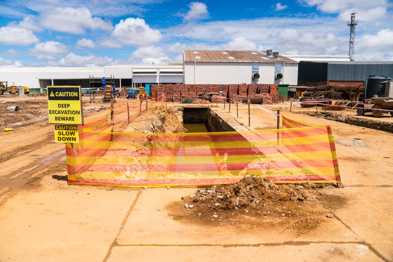 Excavation with safety barriers